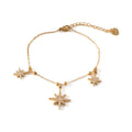 Bracelet Snow doré en acier inoxydable 316L avec étoiles pendantes serties de strass